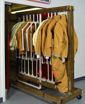 Turnout gear organized on a drying rack
