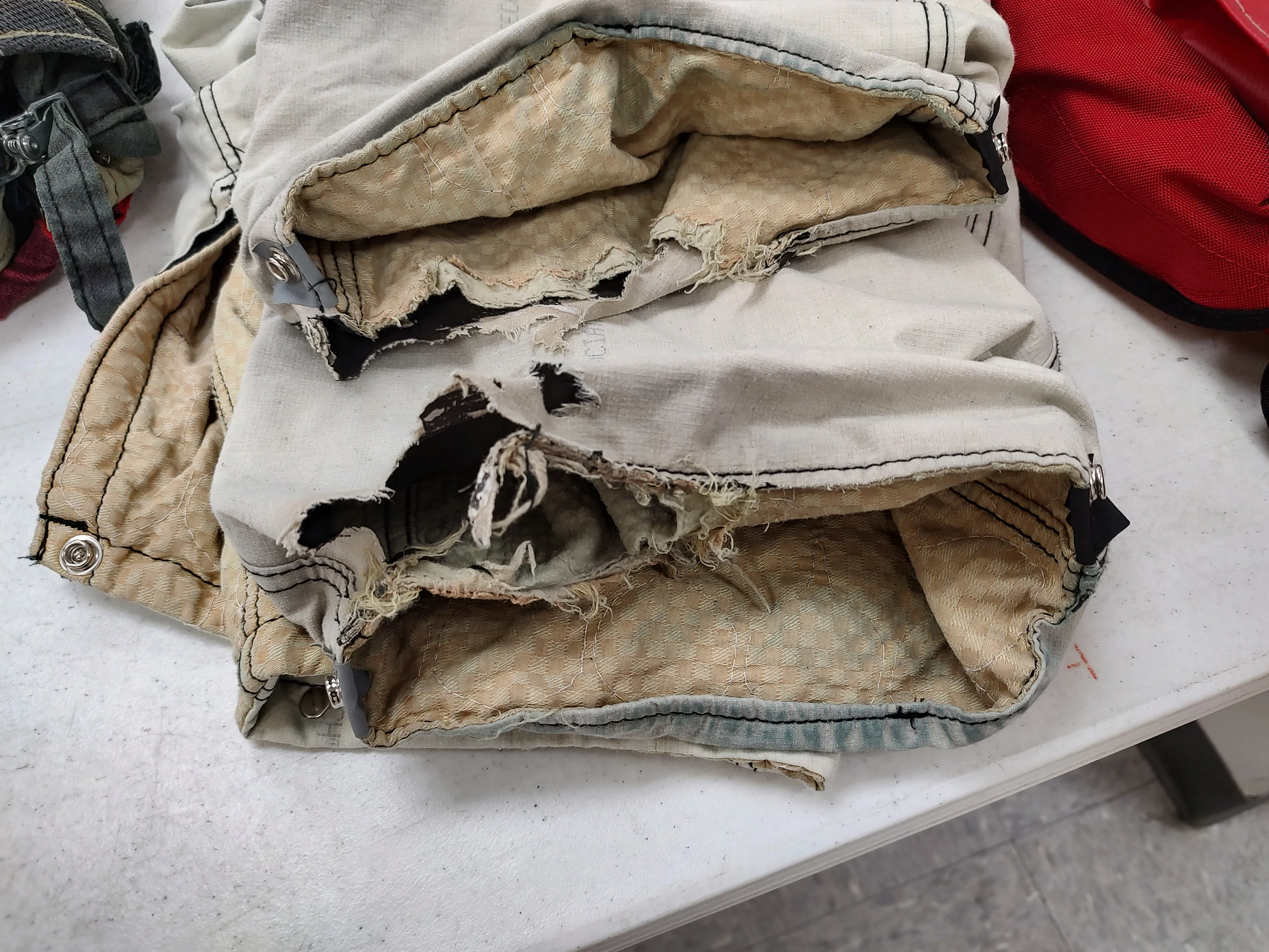 Stacked turnout gear in rough condition